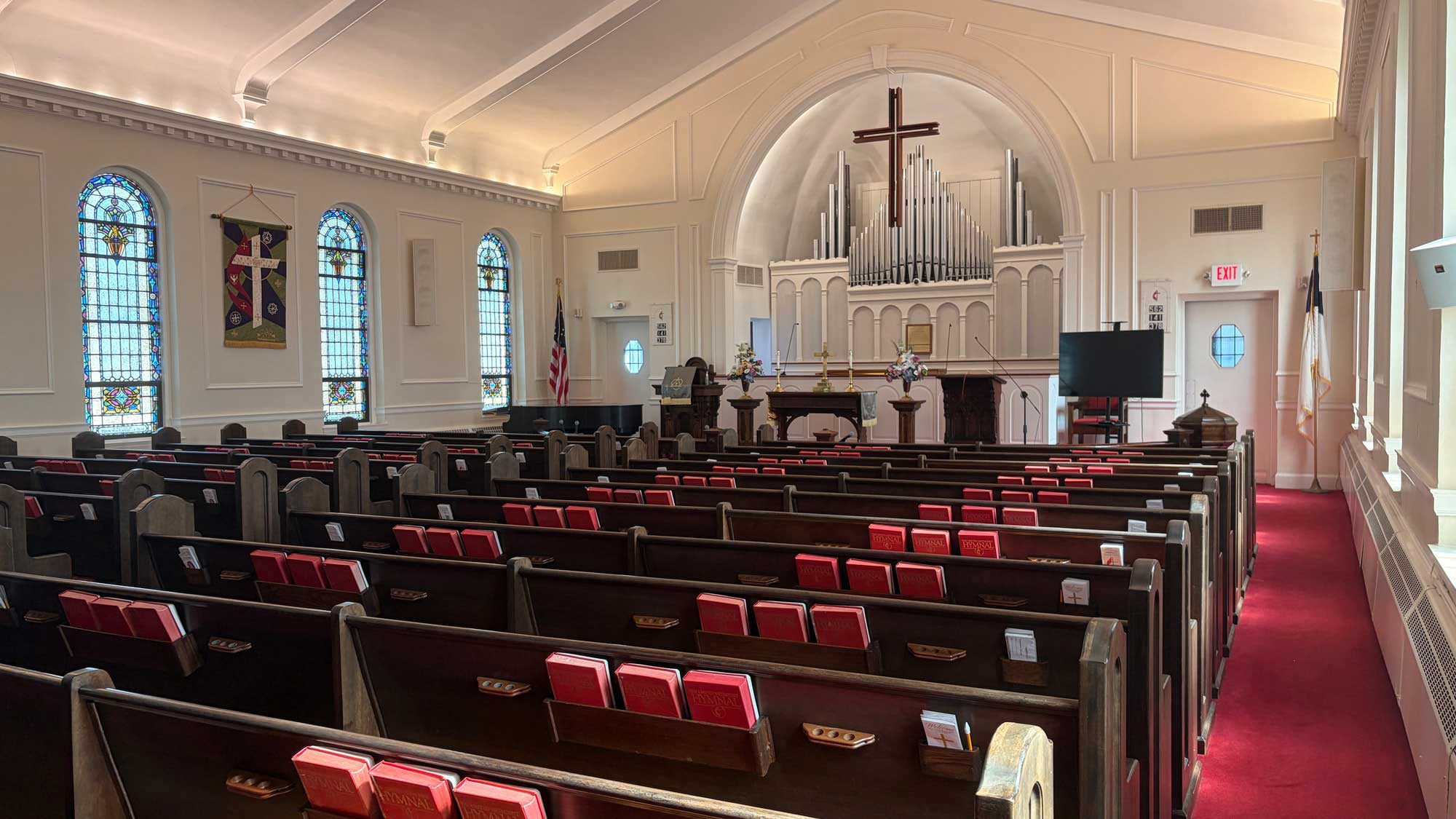 Friendship Hall with rectangular tables and chairs